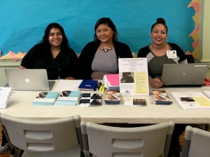 PCC West Town Family Health Center staff at welcome table 